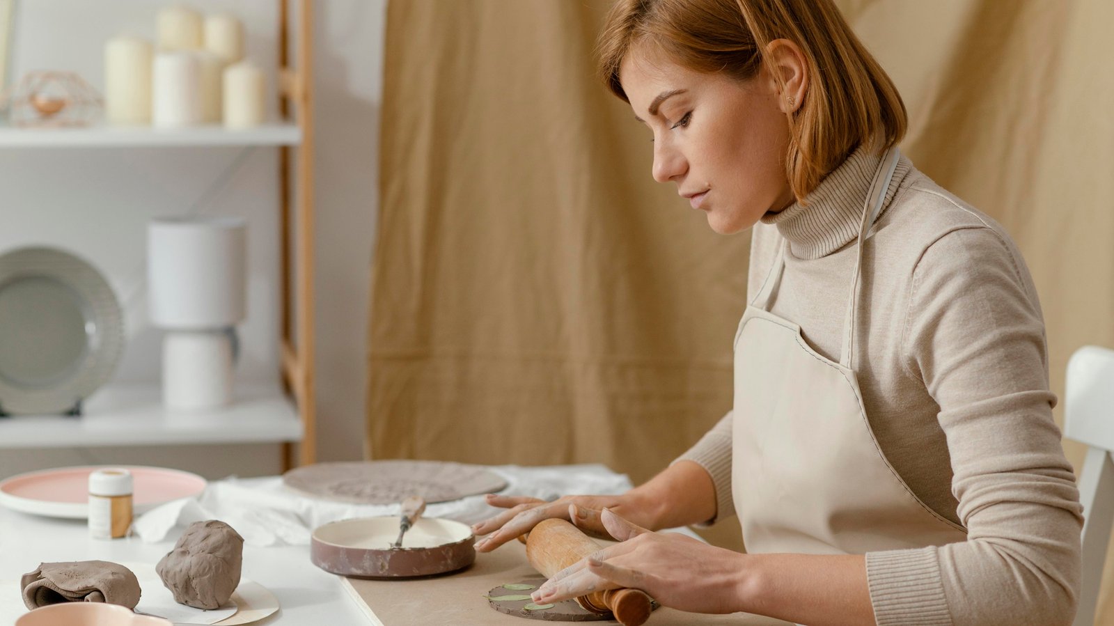 http://img.b2bpic.net/free-photo/close-up-woman-working-with-rolling-pin_23-2148878431.jpg
